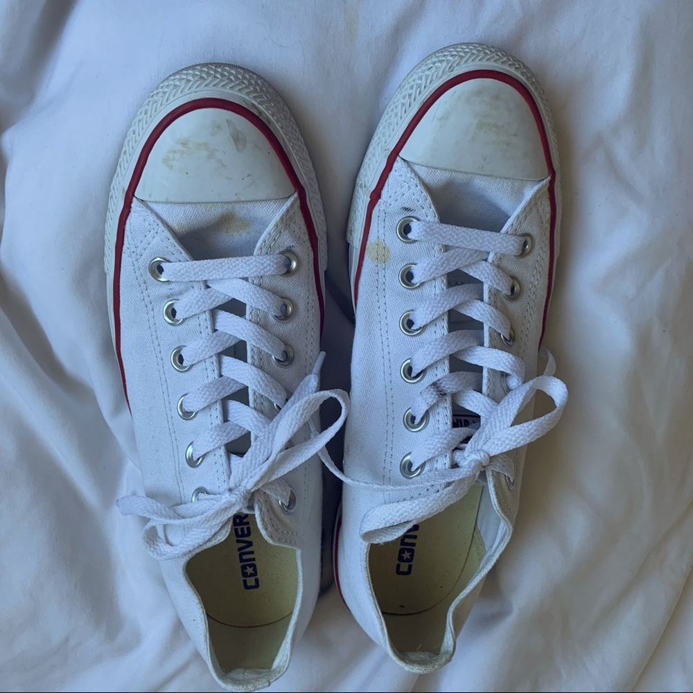 White low top converse with red line